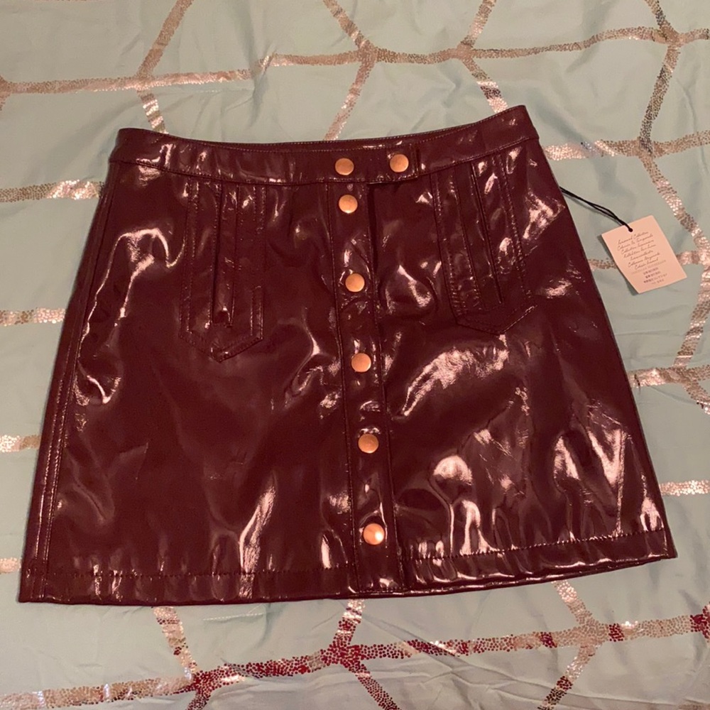 Burgundy colored mini skirt